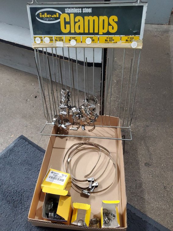 Lot 218: Ideal Stainless Steel Hose Clamp Display Rack w/ Assorted Clamps