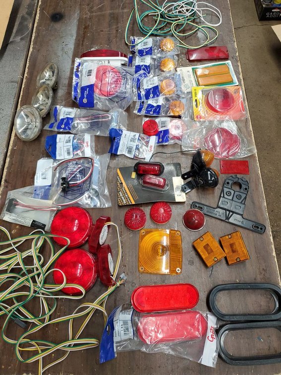 Lot 240: NAPA /Truck-Lite Trailer Light Parts Lot Lenses Markers Wiring Mixed