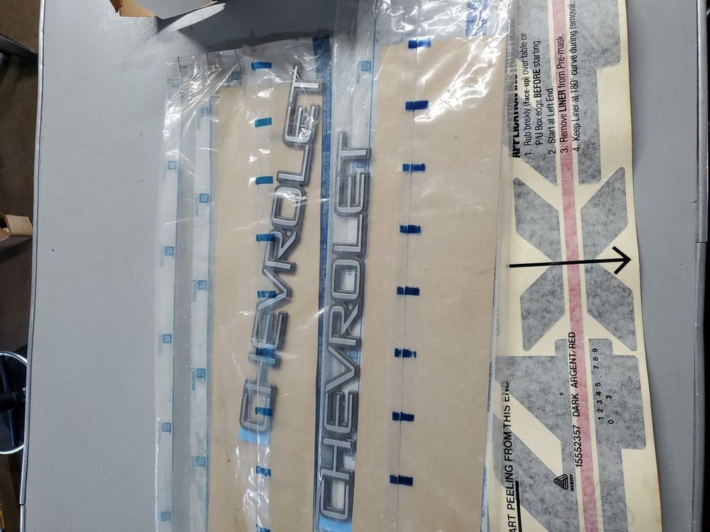 Lot 246: Genuine GM Chevrolet Nameplate Emblem & Decal NOS OEM Parts