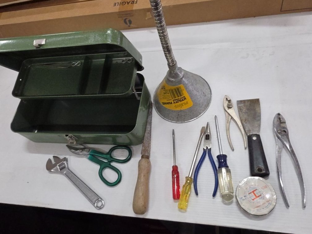 Tool box with hand tools and funnel