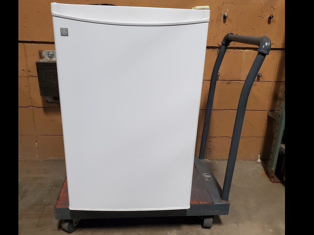 Lot 63: Refrigerator with cart