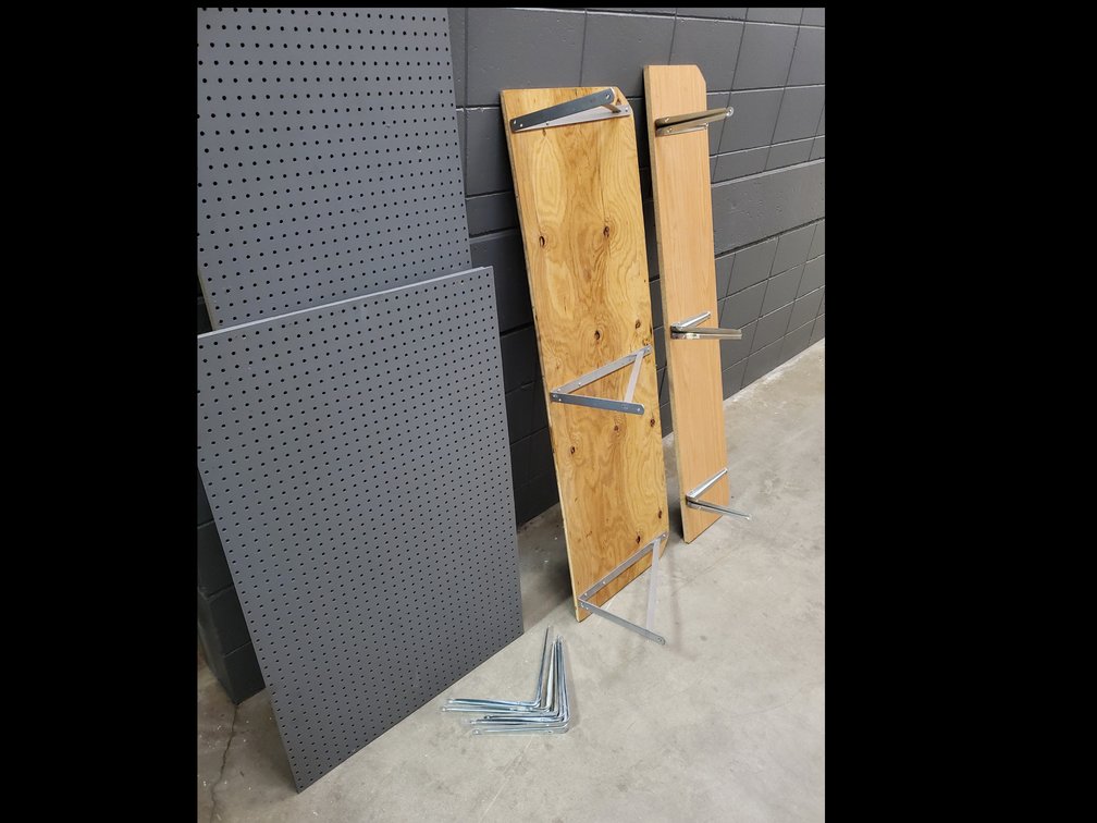 Lot 114: Shelving,peg board and brackets 