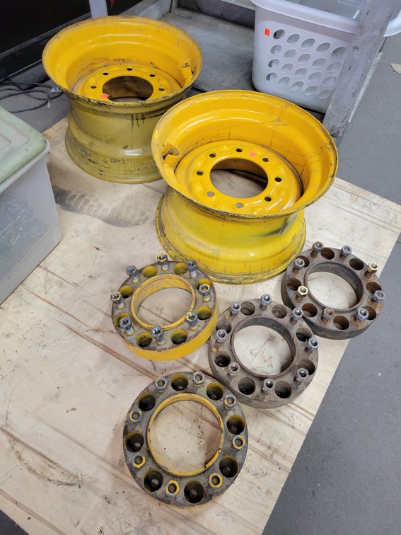 (2) 16.5" Skidloader Steel Rims and (4) Wheel Spacers