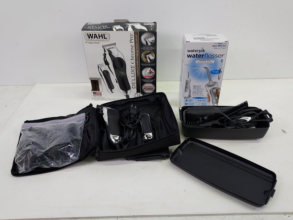 (2) Sets of Hair Clippers & New Water Flosser