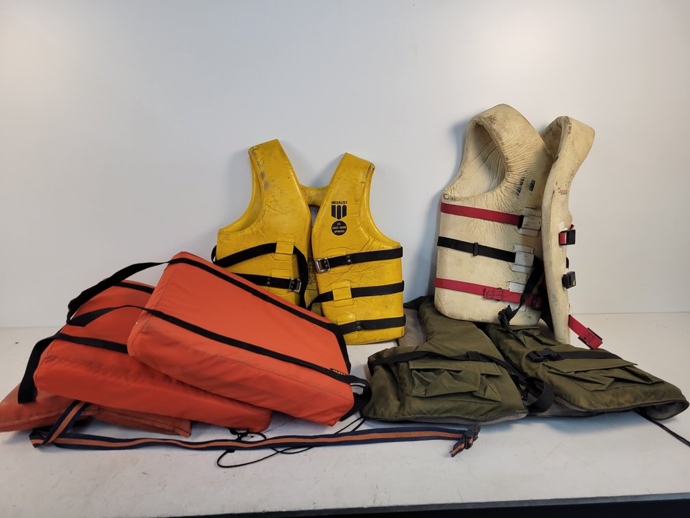 (4) Life Jackets and (2) Float Cushions