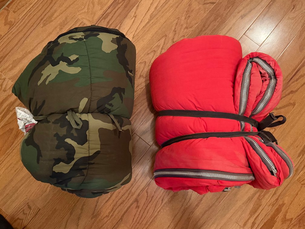(2) sleeping bags and a duffel bags
