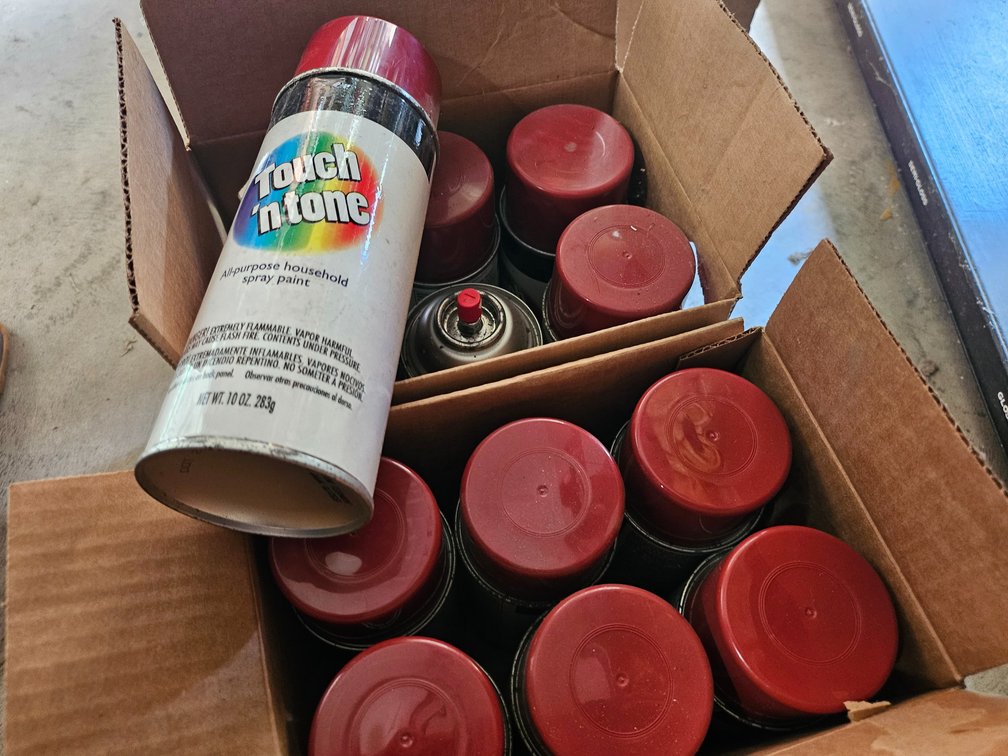 12 cans red spray paint