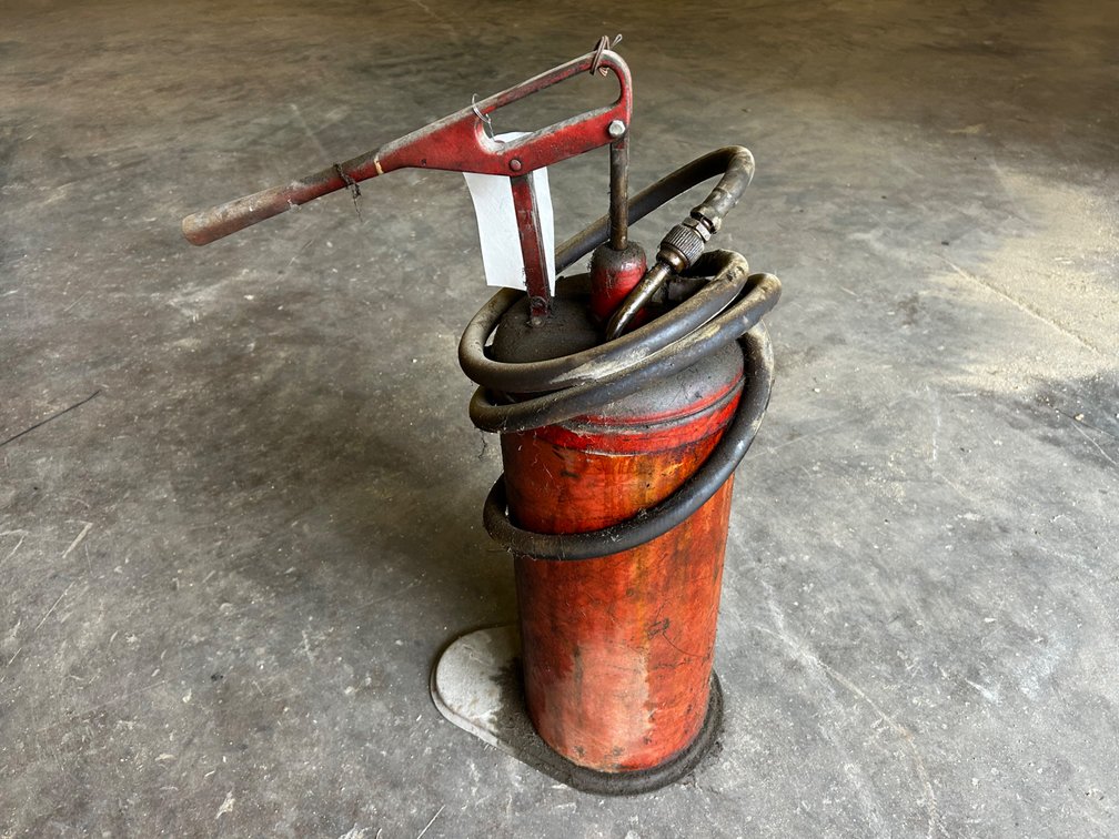 Vintage hand pump oil can