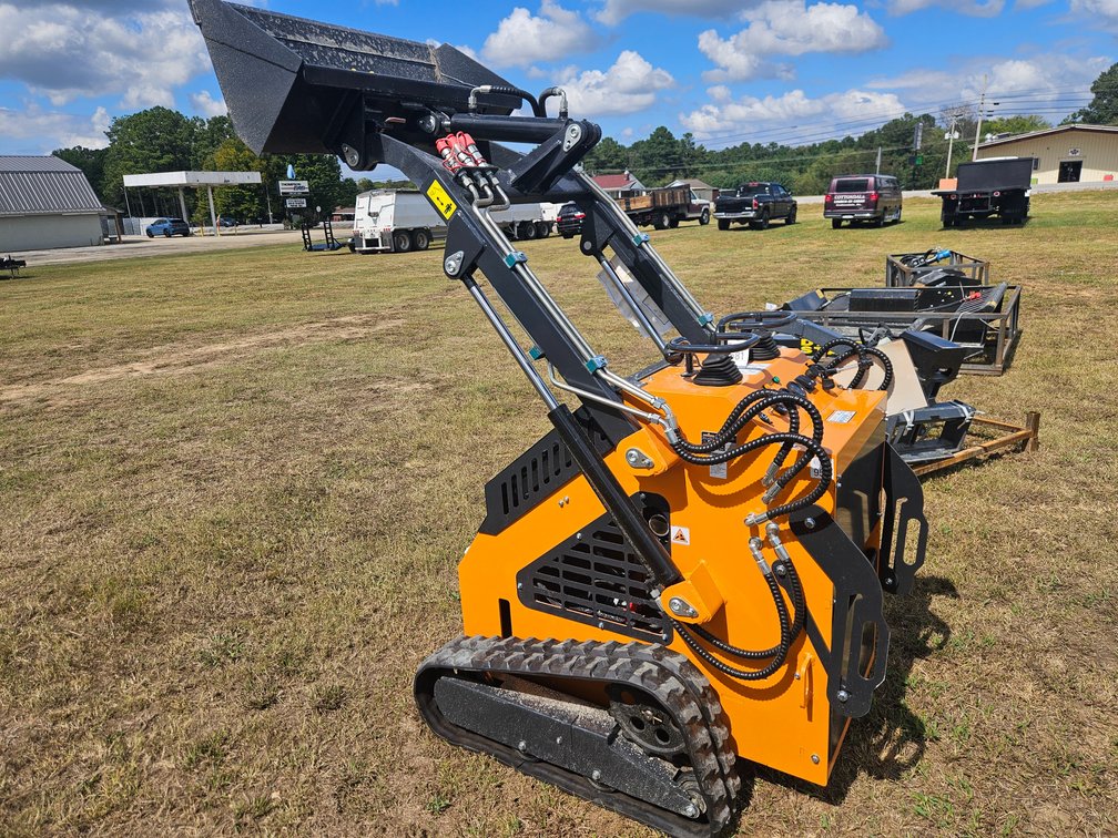 Mini stand on skid steer loader