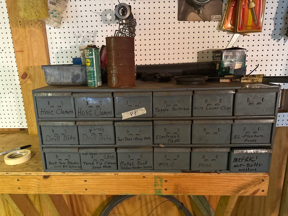 Gray drawers and contents items sitting on top included