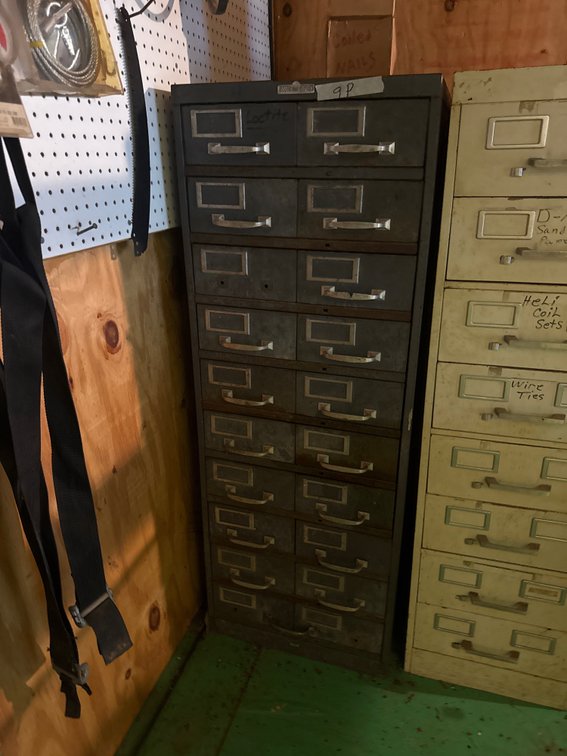 Gray file cabinet and contents