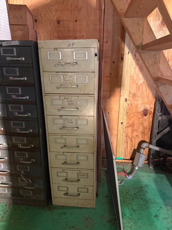 Tan file cabinet with contents