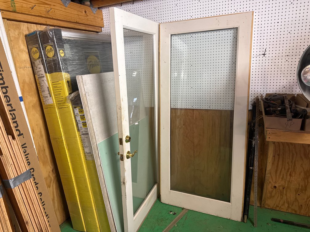 3- pella windows, 2- doors and 4-1/5” x 3’ x 5’ concrete board