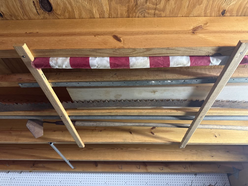 Hoe, bow saw blade, flag, hinge