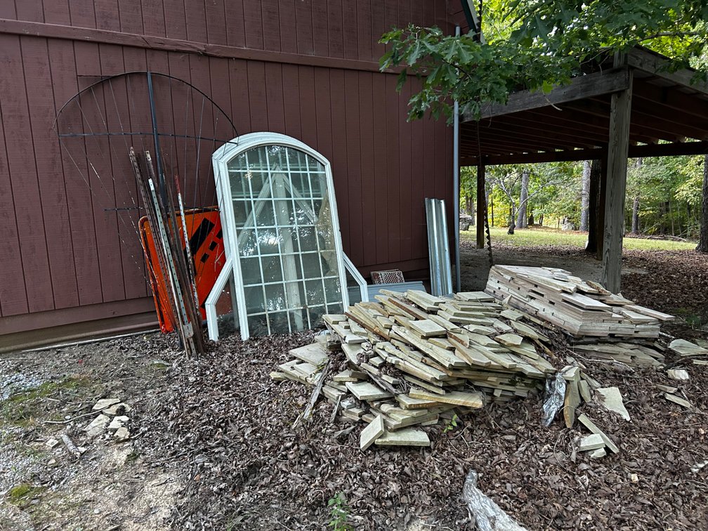 Building supplies behind shed
