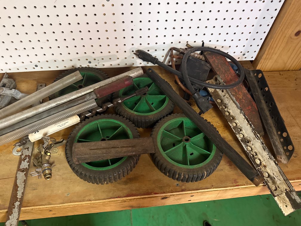 Mower wheels, boring bit, metal wedge and misc.
