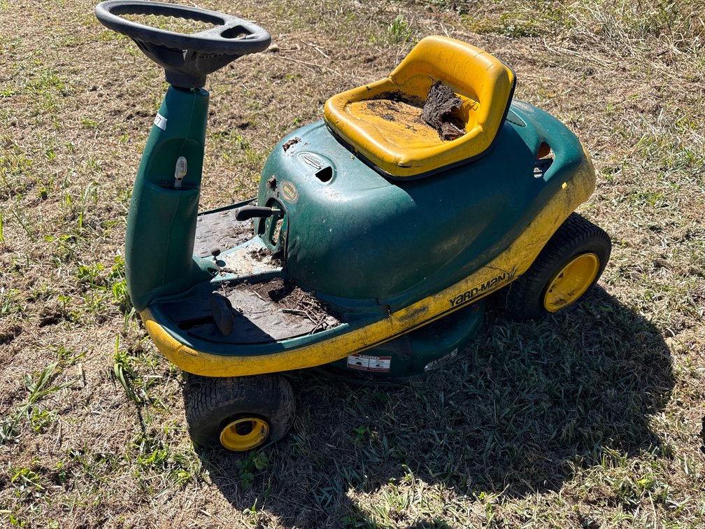 Yard man riding mower