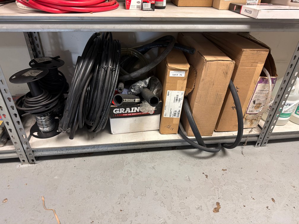 Lot: assorted fuel line hoses on bottom shelf