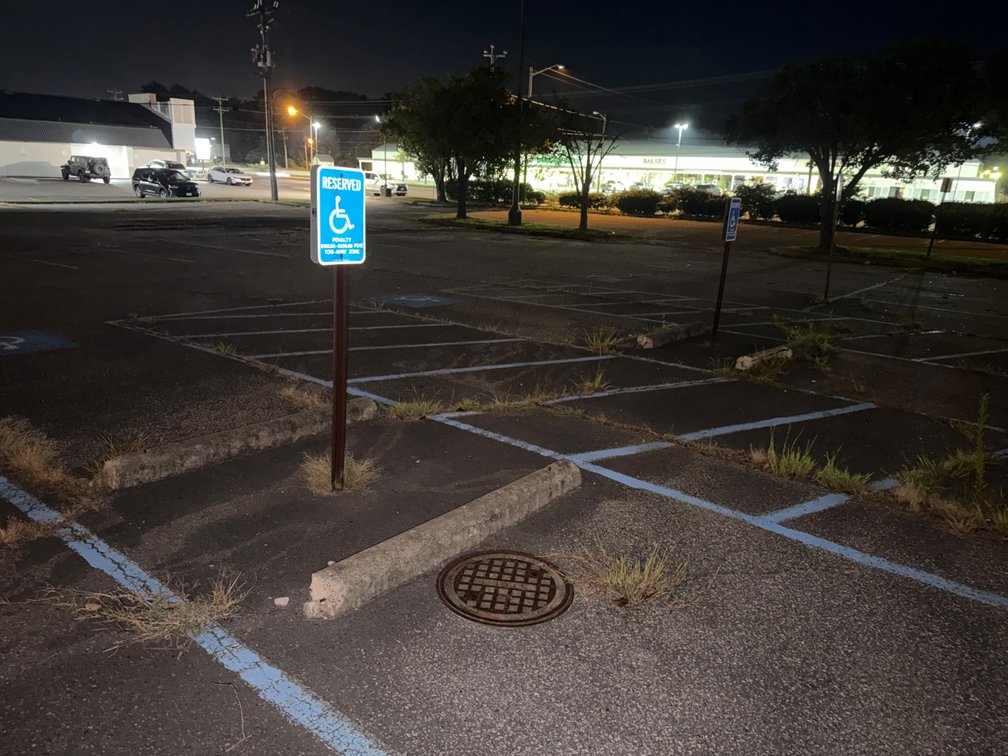 Concrete curb stops & handicap parking signs