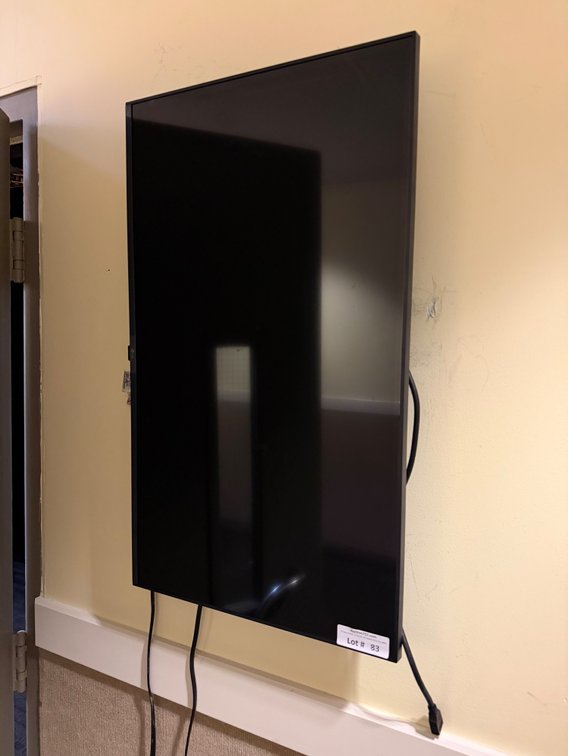LG flat screen TV w/ wall bracket