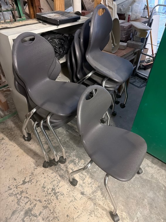 Black plastic rolling chairs with metal legs