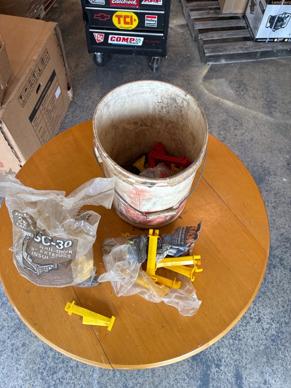 Bucket of electric fence supplies