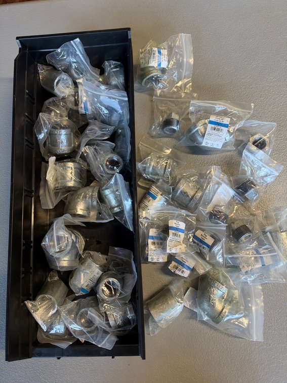 Lot of pipe parts, plugs and elbows