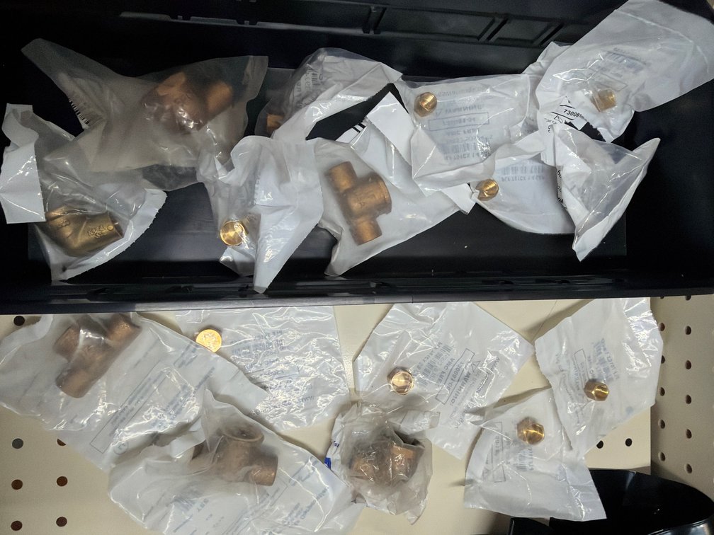 Lot of pipe joints and nut fittings
