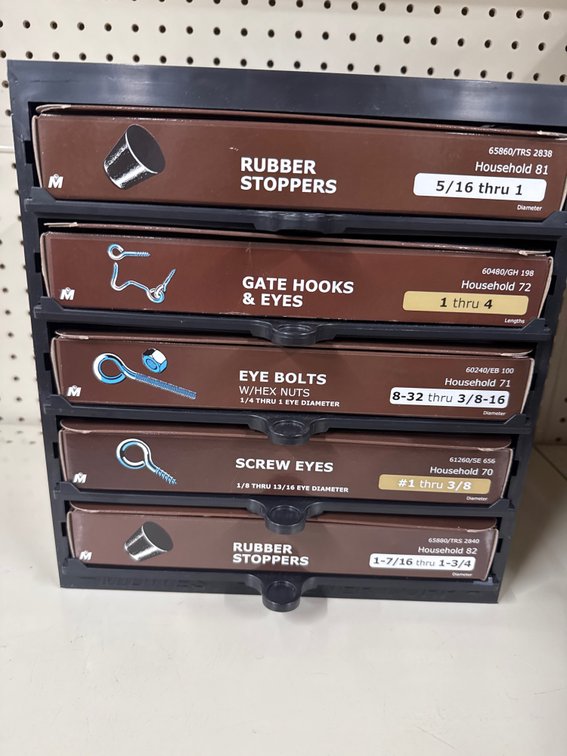 Lot of rubber stoppers, eye bolts and screw eyes