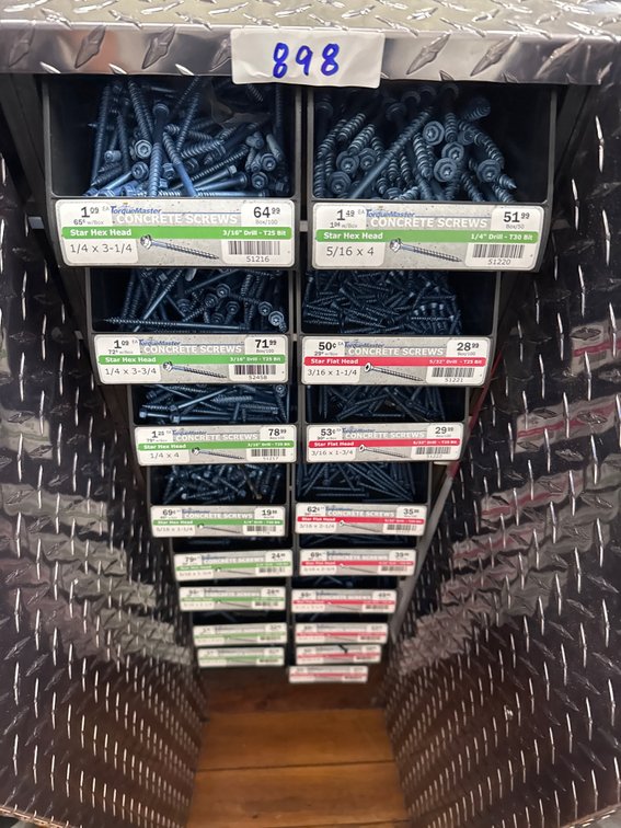 Large lot of concrete screws and bins