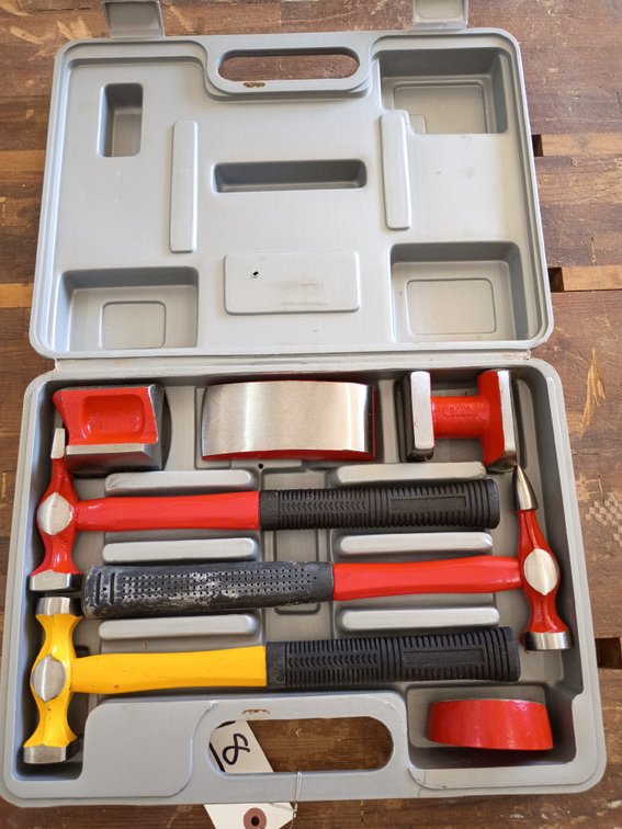 7-piece auto body hammer and dolly set used for metal shaping and dent repair