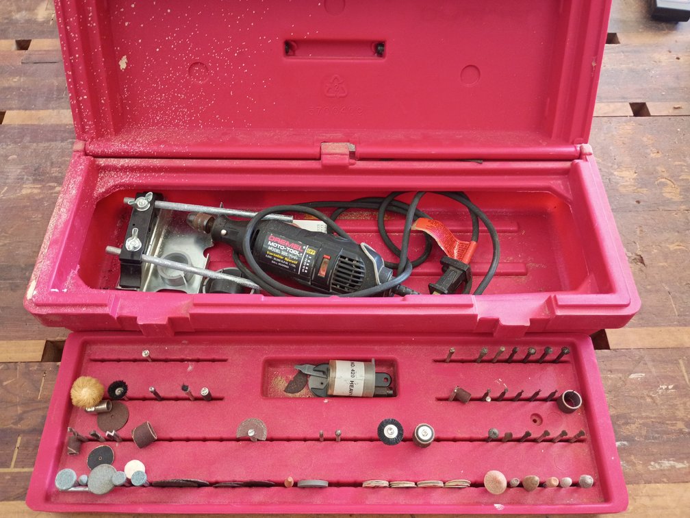 Dremel Moto-Tool Model 395 Type 4 variable speed rotary tool resting inside a red tool case