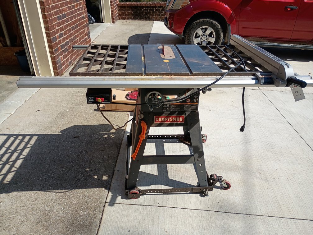 Craftsman 10-inch contractor/stationary table saw with a cast iron top and a rip fence system.