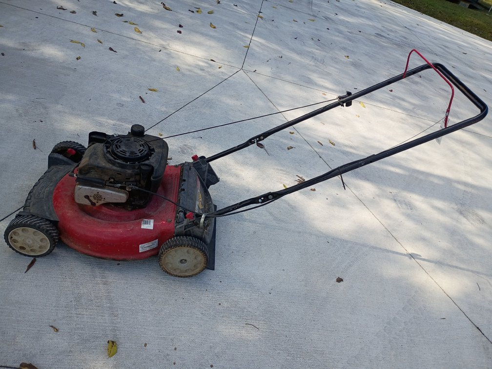 red Troy-Bilt walk-behind gas lawn mower