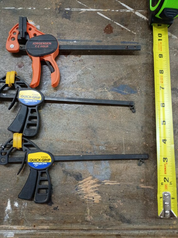 one Pony Jorgensen E-Z HOLD Medium-Duty Bar Clamp (orange) and two IRWIN QUICK-GRIP Bar Clamps (black and yellow