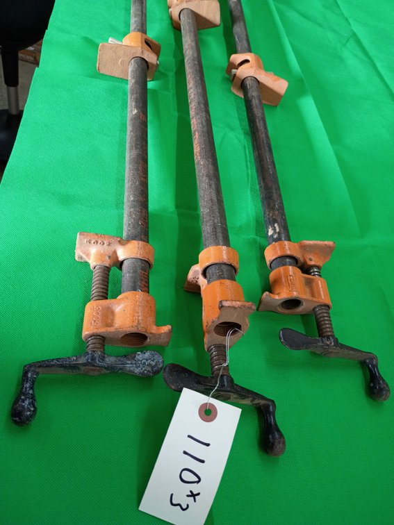 3 Pony 3/4-inch pipe clamp fixtures mounted on long steel pipe segments