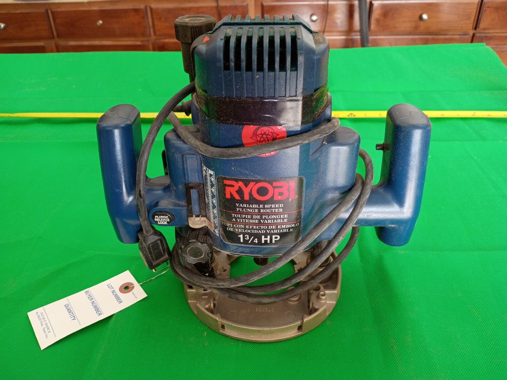 blue and black Ryobi RE175 1-3/4 HP variable-speed plunge router.