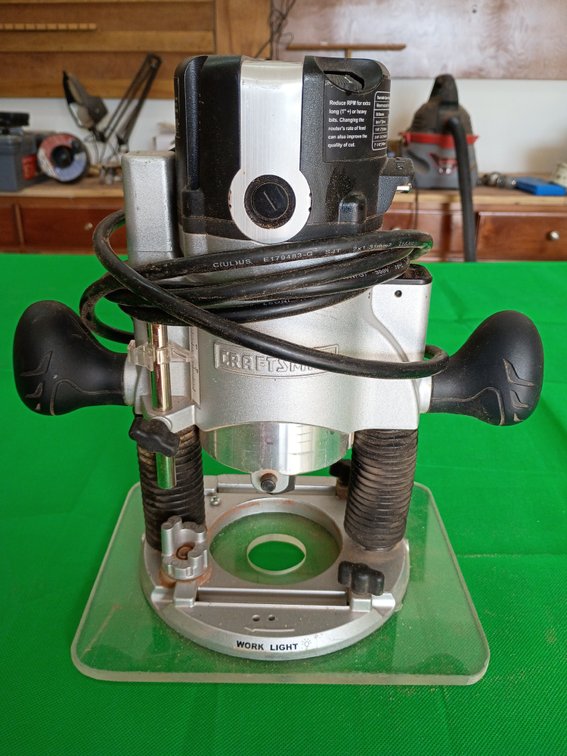 Craftsman corded plunge router with a built-in work light and a clear sub-base plate