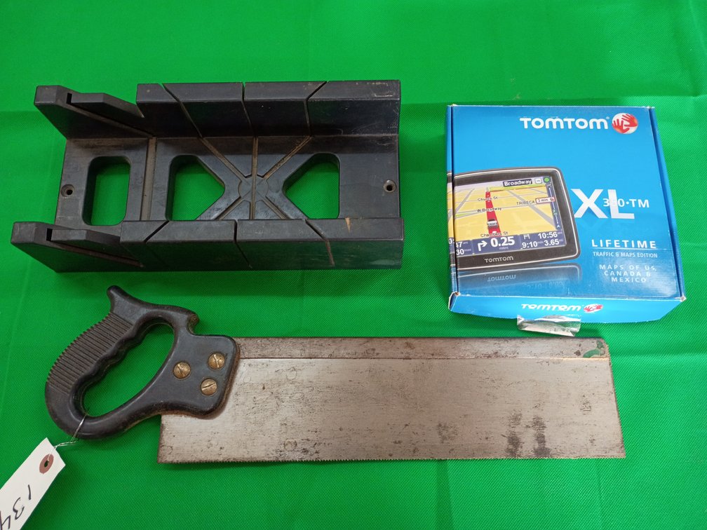 Handsaw a saw guide and a TomTom navigation