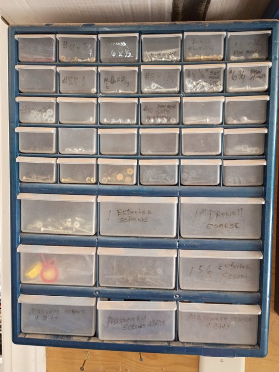 plastic multi-drawer small parts and hardware storage cabinet, similar to a 42-compartment organizer with items
