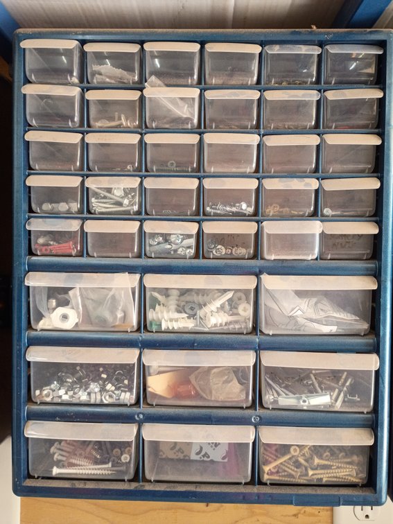 plastic multi-drawer small parts and hardware storage cabinet, similar to a 42-compartment organizer with items