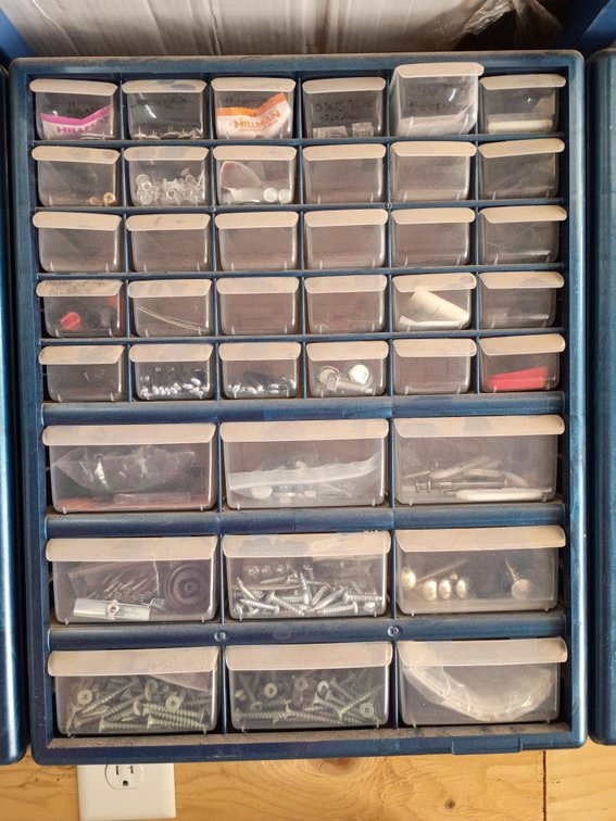 plastic multi-drawer small parts and hardware storage cabinet, similar to a 42-compartment organizer with items