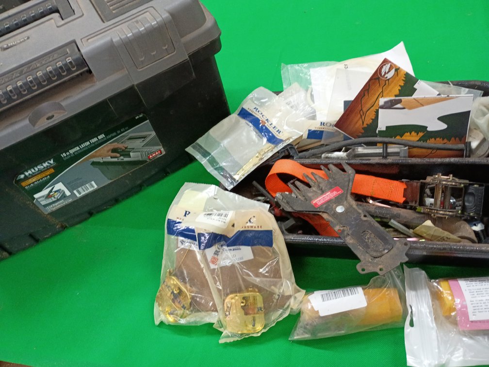 Husky tool box with a variety of items