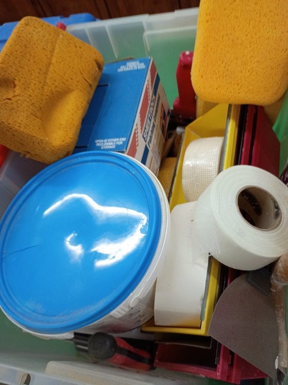 Drywall tools in a tub