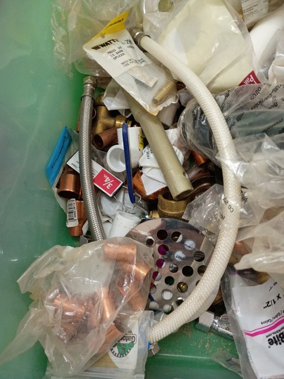 Tub with various plumbing items