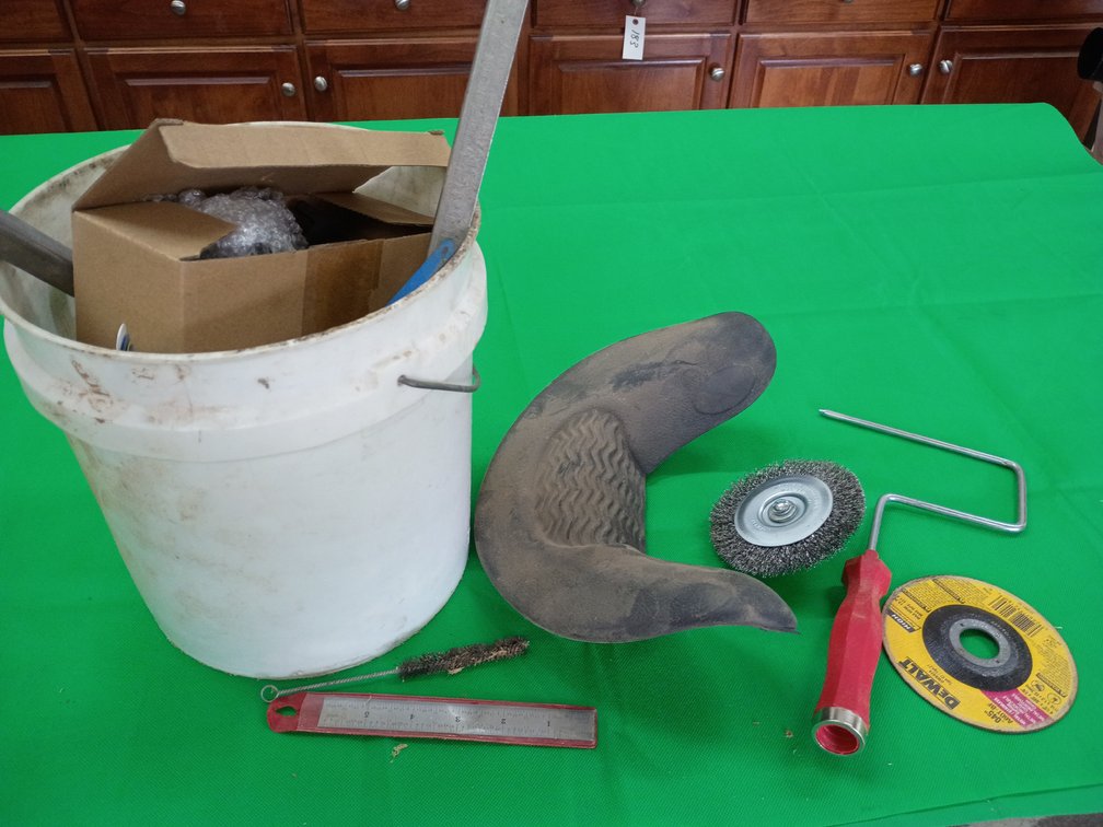 White bucket of miscellaneous items