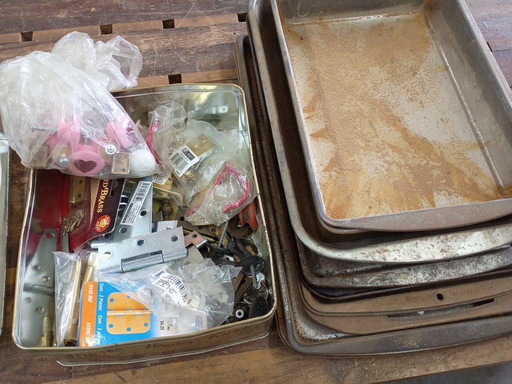 Used metal cookie sheets tub of door knobs and hinges