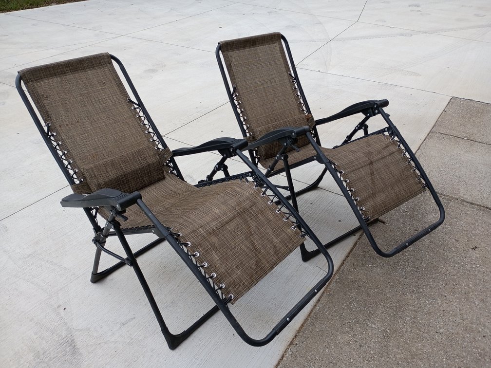 Two reclining lawn chairs