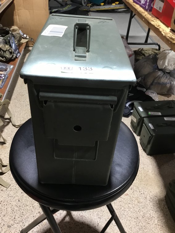 A green military metal ammunition box