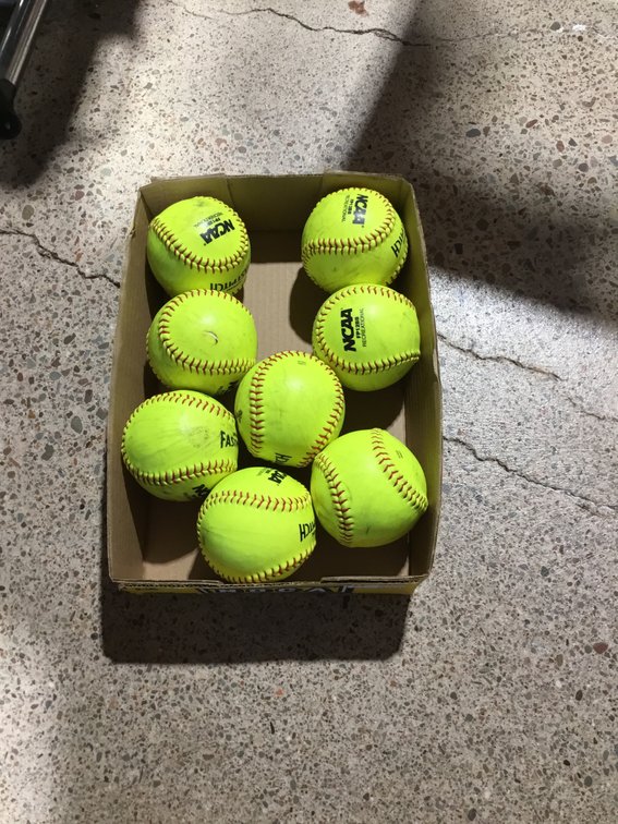 Eight fast pitch softballs